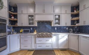 Jerry Harris Remodeling Kitchen remodel. Grey cabinets with a herringbone backsplash in blue tile.