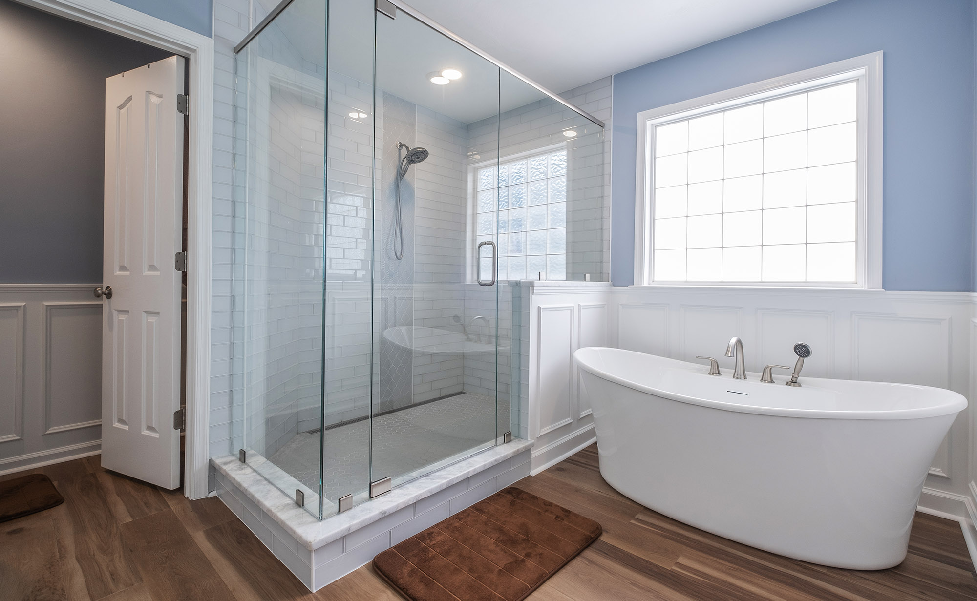 Large master bathroom remodeling project. Soaking tub with large walk in shower with glass doors and walls.