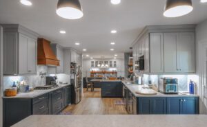 Open Concept Kitchen Remodel with two tone cabinetry, recessed lighting, matching built in cabinets with floating shelve in dining room.