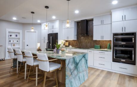 Kitchen remodel located in Freemason neighborhood in downtown Norfolk, VA. Modern white cabinets, a large island with a Da Vinci quartzite waterfall countertop.